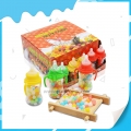 Biberón pequeño de 3 colores con tetina y caramelo duro de frutas 