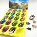 Nuevo y divertido producto: huevo de dinosaurio colorido, juguete de caramelo. 