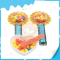 Caramelo duro de frutas con sabor a girasol y palito de gomita 