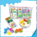 Juguete de plástico 3 en 1 con dulces caramelos duros. 