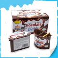 Mermelada de chocolate envasada en taza con palito de galleta 