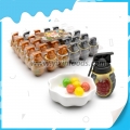 Chicle con sabor a fruta en botella con forma de granada 