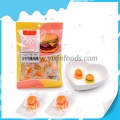 Caramelos gomosos tipo hamburguesa con sabor afrutado en envase individual. 